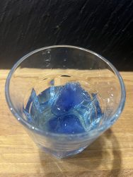 Gin with blue ice cubes