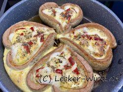 Herzhaft gefüllt: Rührei und Käse im Bratwurstnest