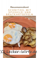 Schnitzel mit Spiegelei und Bratkartoffeln
