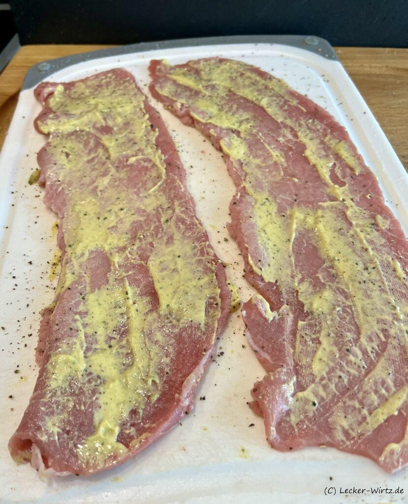 Winzerschnitzel vom Kalb mit Senf einstreichen